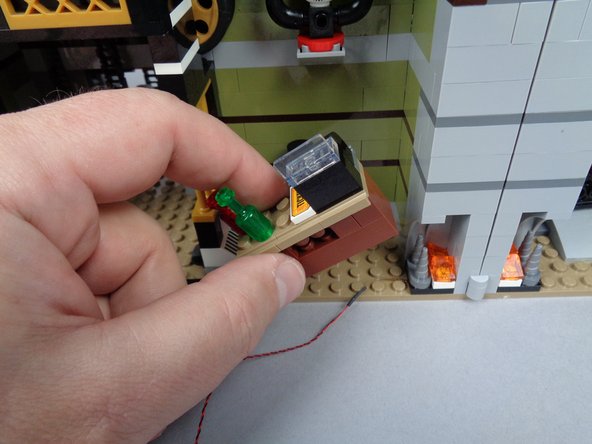 As shown in the first photo for this step, remove the front desk.