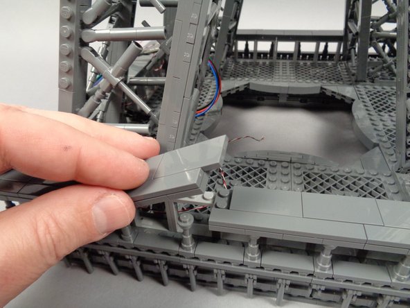 Make sure the wire passes UNDER the "X" shaped frame at the base of the pillar, and BEHIND the window frames.