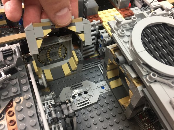 Begin installing the rear interior lights by removing the top door frame from the rear interior room as shown in the third photo.