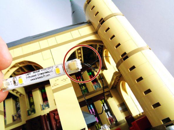 Take the three light strips from Bag 10 along with the two short (1.5&quot;) connecting cables and connect the strips end-to-end as shown in the first photo.