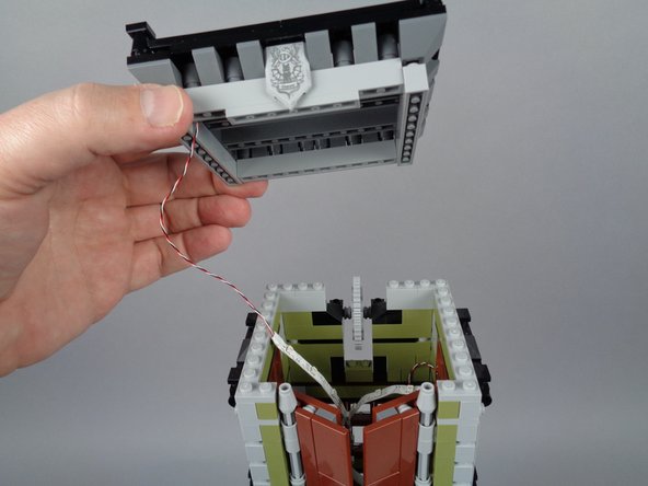 Be careful removing the roof section, as the two front top tower doors may come loose and won't be supported while the roof is removed.