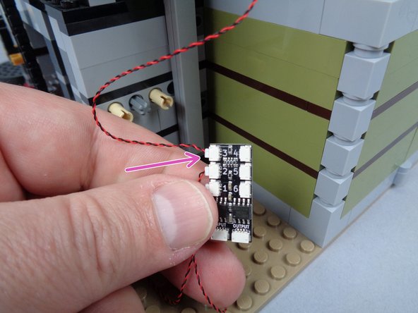 As shown by the purple arrow in the third photo, connect the jewel case light wire to plug #3 on the second BRANCH06X adapter board.