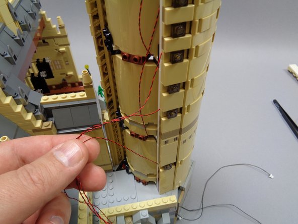 Next you will run the wires from the eight window lights DOWN into the space beneath the castle.