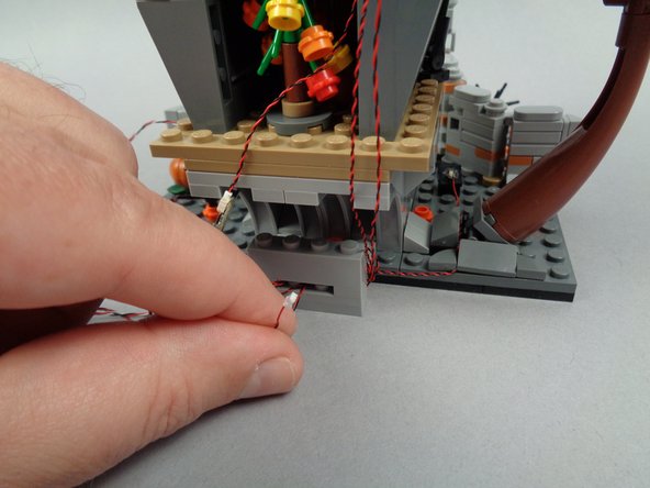 As shown in the first and second photos for this step, take the light wire for the blackboard light and connect it to plug #3 on the BRANCH06X driver board.