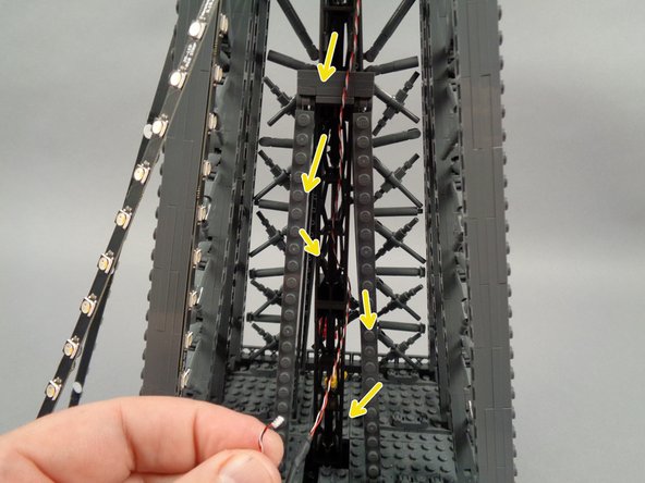 As shown in the third photo, the wire should be just long enough to reach the bottom of the top section.