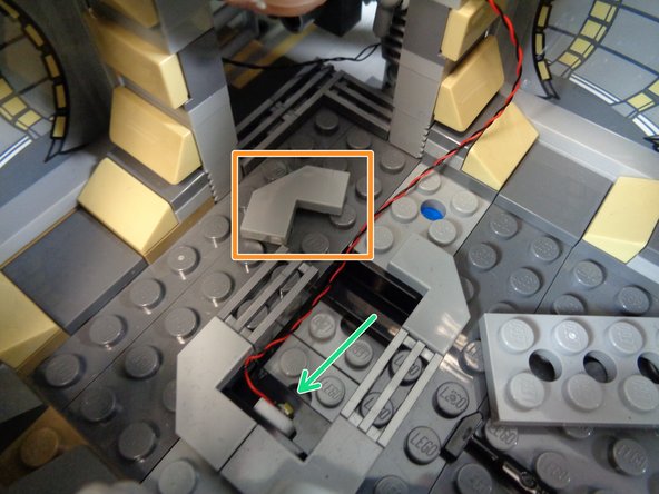If you want to mount a light under the rear interior room floor grille, you can remove the 2x4 LEGO plate from the floor, remove the corner tile (orange rectangle in the first photo), and use a small sticky square to mount the light inside the opening as shown by the green arrow in the first photo.