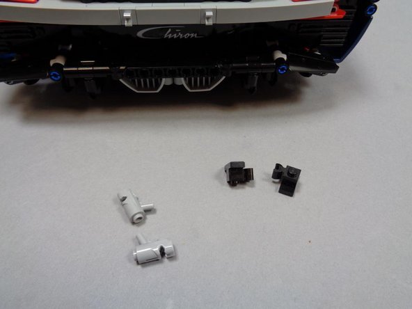 Remove the two &quot;blaster&quot; parts that came with your LEGO® set.  You will not need them any longer.