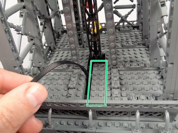 As shown by the green box in the second photo, re-attach the 2x8 plate.