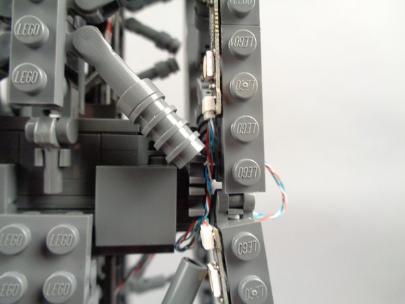 As shown in the photos for this step, you can use the tweezers to tidy up any visible sections of wire connecting the 17-LED sections and 20-LED sections of both light strips.
