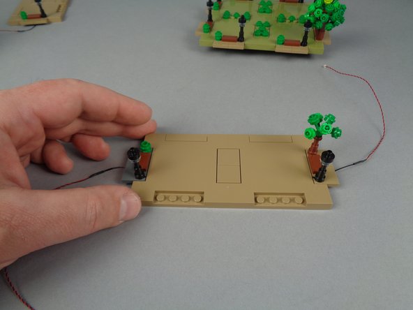 When you are finished mounting the LED lights inside the two lamp posts of Panel 1L, they should look like the setup in the first photo for this step.