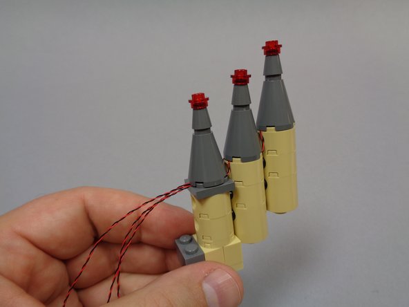 After re-installing all three small towers, your setup should look like the assembly in the third photo.