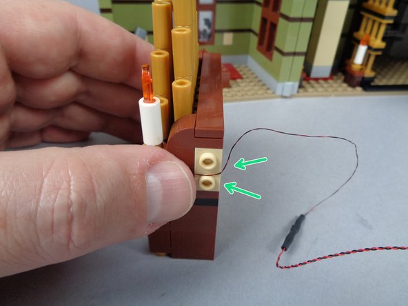 As shown in the second step, remove the brown side part from the right side of the organ, and re-install the first candle.