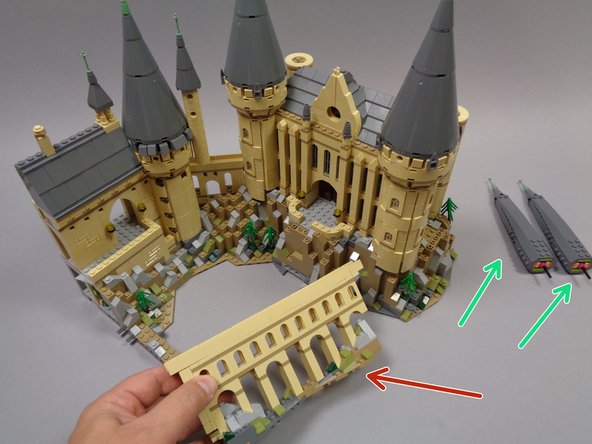 To make installation easier, you will need to remove the two tall, narrow towers from the rightmost rear section of the castle as shown by the two green arrows in the first photo.