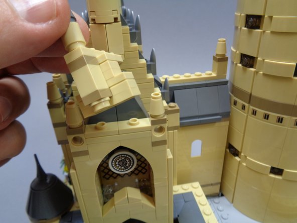 Next you will disassemble a large portion of the courtyard clock tower so you can mount the remaining two lights with 6&quot; cables.  Follow the disassembly steps in the photos.