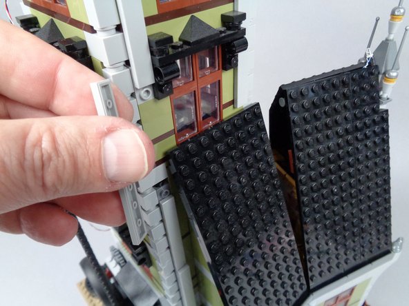As shown in the photos for this step, remove the long supporting tiles in the middle of the tower on three sides.