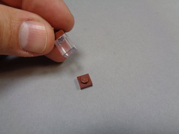 As shown in the second and third photos, remove the lantern and then the transparent brick that forms the lantern top.