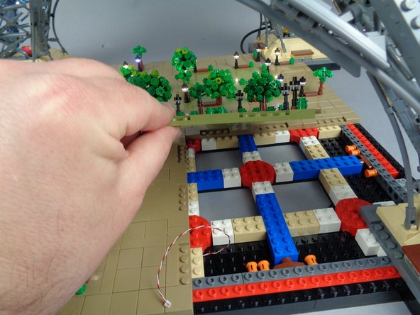 As shown in the photos for this step, remove the large center Panel 4.