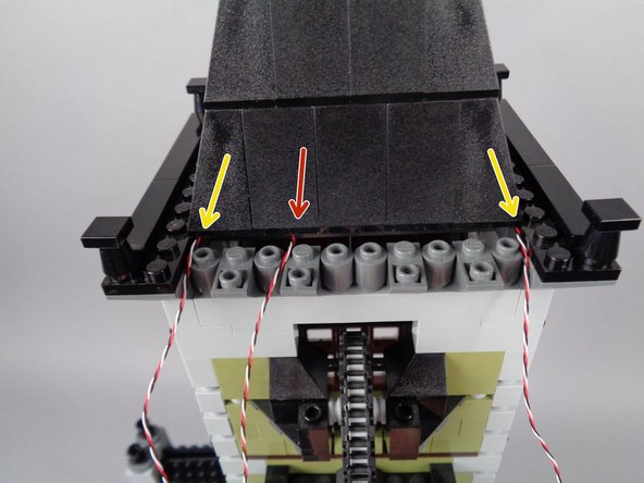 When your roof section is re-attached, your setup should look like the third photo for this step: