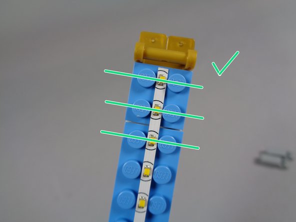 Make sure the lights on your light strip are correctly aligned as shown in the two photos for this step.
