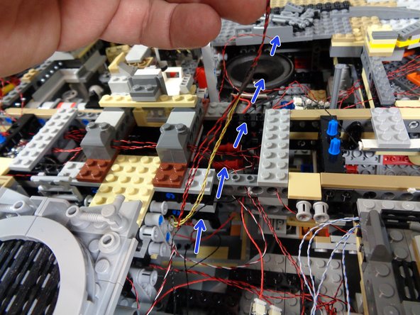 Make sure no wires are caught under any pins when re-inserting them. If wires are caught, they can become pinched or cut.