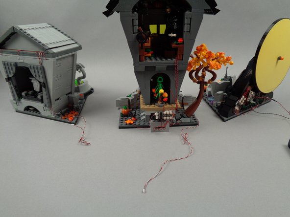 Optionally, as shown in the photos for this step, you may also choose to coil up excess wire for the control wires that run between sections of your LEGO set.  This will make for a cleaner setup, but just make sure the wires can be easily accessed if they need to be connected/disconnected in the future (for transport or movement of your LEGO set).