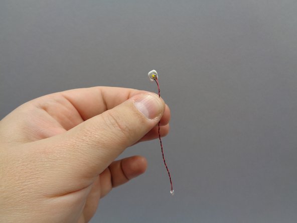 As shown in the third photo, attach a sticky square to the back of the warm white Pico LED light with the 3&quot; (7.6cm) wire.