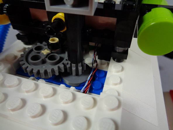 Before proceeding, check one last time to make sure no wires are close enough to any gears to get caught.