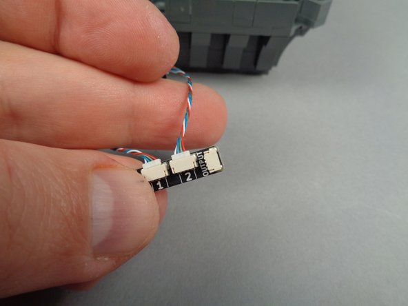 As shown in the first photo for this step, you will begin with the LED light strips connected to plug #2 on the adapter board.