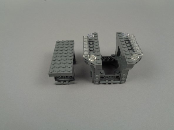 As shown in the photos for this step, finish disassembly by removing the large center plate and windows beneath.