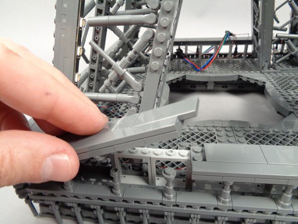 Make sure the wire passes UNDER the "X" shaped frame at the base of the pillar, and BEHIND the window frames.