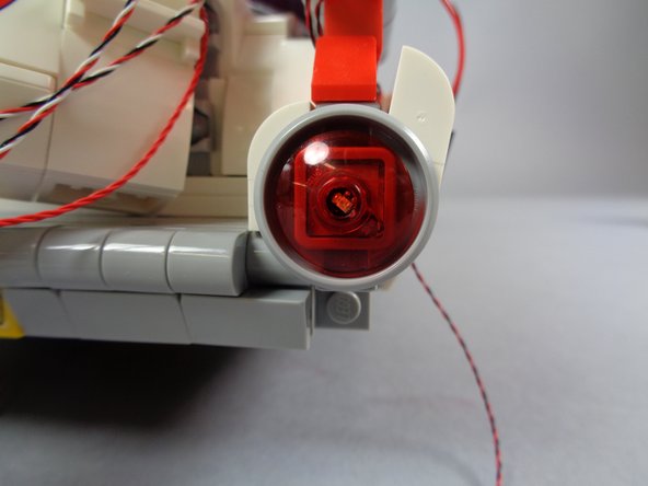 This will pinch the wires of the red Pico LED underneath, but if you have allowed a little slack and pressed the wire with your fingernail as outlined in the previous step, the light should not be damaged.
