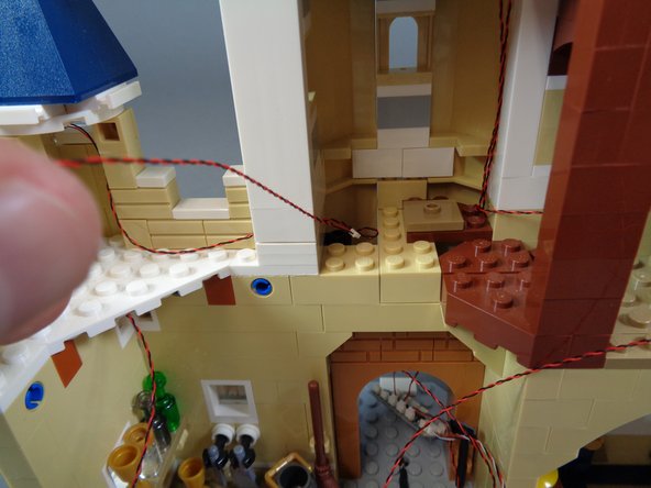 Do not route the wires for the bedroom or magic room light now.  You will do this soon.