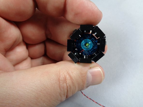 As shown in the third photo, close the circle of plates around the engine core.