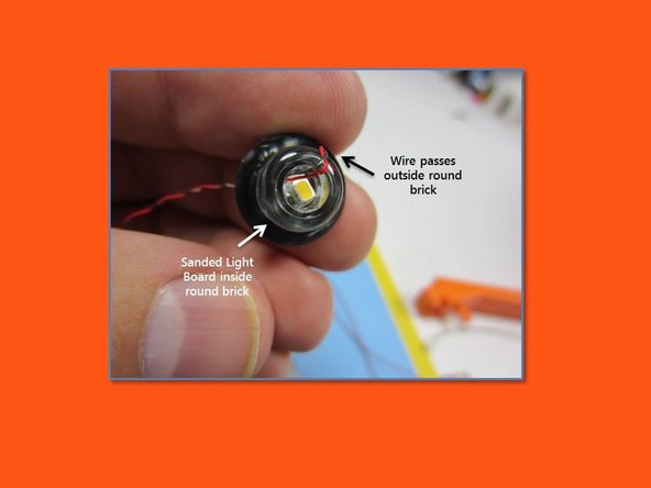 In step 46 of the building instructions, mount four Micro Light Boards inside the clear round brick elements, using 4 Trans-Yellow 1x1 round plates to hold the wires as they pass outside the globes and wrap back up the side of the assembly the through the top of the light.