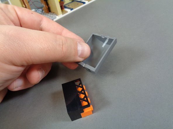 As shown in the second photo, put a small sticky square on the back of the orange Pico LED light.