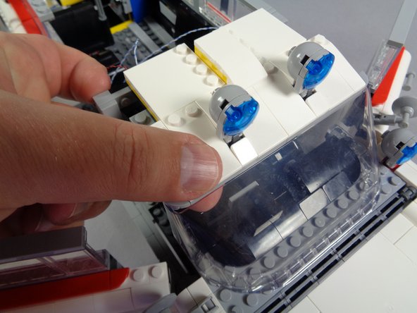 Now you will re-attach the front roof section.