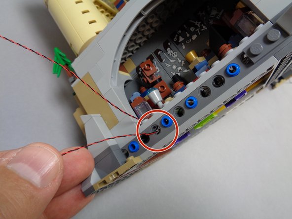 As shown in the second photo, replace the 1x1 clear brick on top of the lantern base with the light inside the lantern.