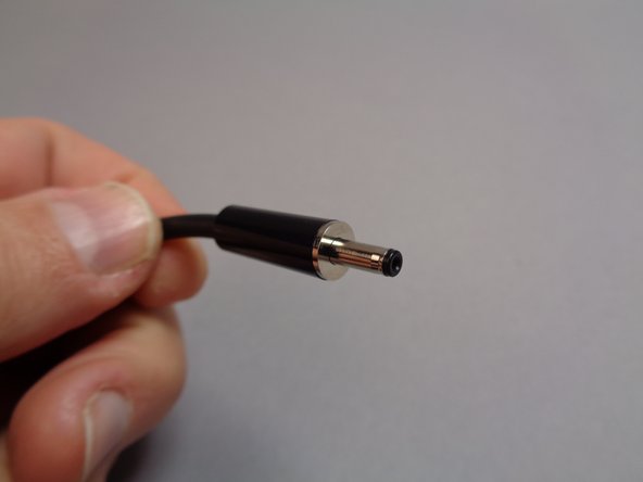 The third photo for this step shows the barrel plug at the other end of the USB-C power connector.  This is the plug that connects to the main controller.