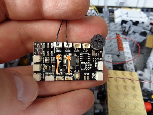 The photos in this step show where to connect the two engine light strips.  The only difference in the photos is that one shows a Version 4 TRUNK08 master controller and the other shows a Version 7 TRUNK08 master controller.  Refer to the photo that matches the version of controller included with your kit.