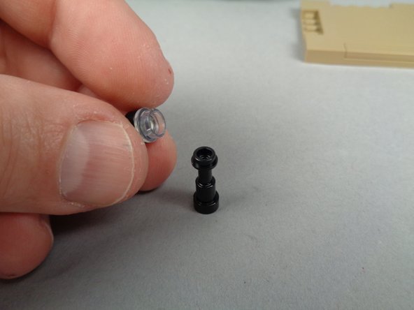 As shown in the second photo, remove the lamp post from its base section.