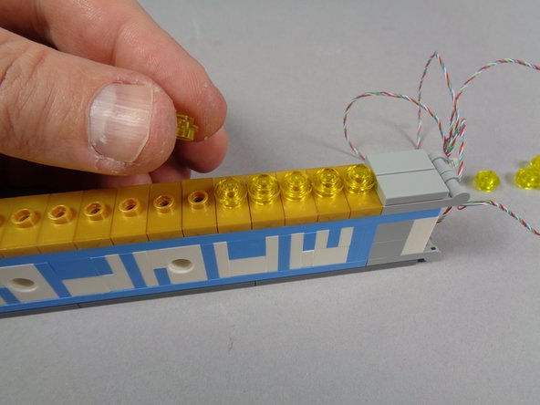 As shown in the first photo, when you have all jumpers re-attached, you should be able to see the lights on the strip through the holes.