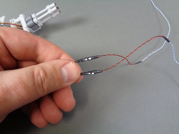 If your connecting plugs look like the plugs in the second photo, you will need to attach the two adapter cables that were included in the same bag as your laser cannon.