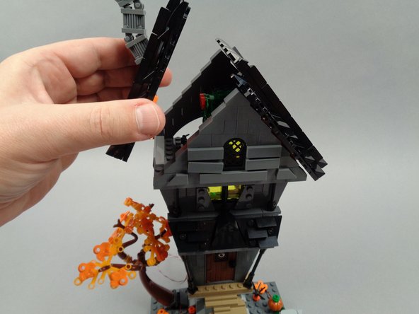 As shown in the first and second photos for this step, remove the roof sections from Jack's house.