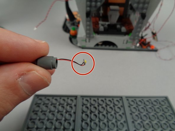 Turn over the town hall roof as shown in the first photo for this step.