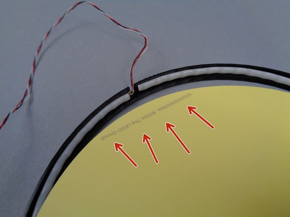 The photos in this step show the full moon frame, but the process for attaching the paper moon is the same for the crescent moon frame.