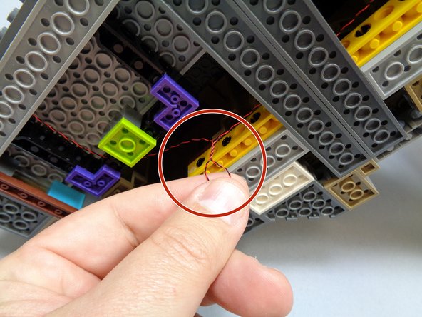 Make sure all wires pass on top of, not under, any plates on the castle's bottom.  This will ensure the wires do not scrape on the surface you display your castle on.