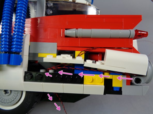 The purple arrows in the third photo show how your wire should run after you have finished.