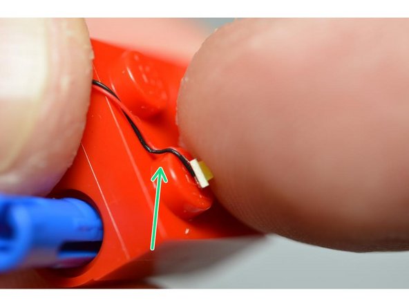 The green arrows show how the LED wires need to be bent in order to prevent them being cut when completing the next step.