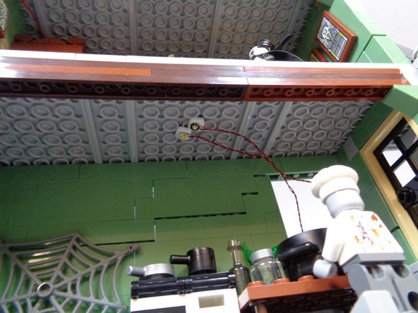 As shown in the second photo, attach the warm white light to the kitchen ceiling next to the green light.