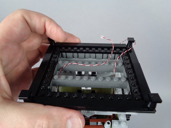 As you re-attach the roof, make sure the tops of the door hinges go back into place so both doors can open and close freely.